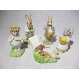 A collection of 5 Beatrix Potter figures by Royal Albert and Beswick