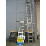 A collection of various ladders, trestles, construction signs etc
