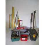A large collection of tools including spirit levels, laser measure, Hilti drills, clamps, tool chest