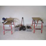A large collection of tools including two work benches