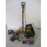 A collection of 110v tools including sanders, Ryobi mitre saw, lights along with a box of various