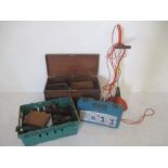 A wooden trunk containing various vintage tools along with a Flymo strimmer, Boschmann drill etc.