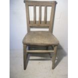 A vintage elm chapel chair