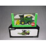 A boxed MarGe Models Claas Jaguar 990 Terra Trac with Orbis 750 Maize Header, along with a boxed