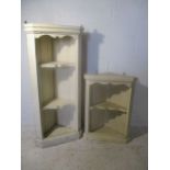 Two painted pine, hanging corner shelving units.