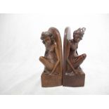 Two Eastern carved book ends, both decorated with female figures