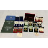 A collection of Isle of Man cased proof sets, boxed crowns etc.