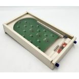 A Chad Valley miniature handheld pinball machine