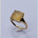 A 9 ct gold dress ring set with a citrine