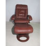 A Stressless style reclining armchair with matching footstool