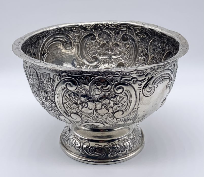 A hallmarked silver bowl with repousse decoration, London 1902 made by the Goldsmiths & Silversmiths