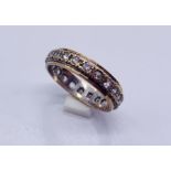 A 9ct gold and silver eternity ring