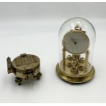 A brass compass along with a Bentima anniversary clock