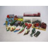 A collection of tin plate vehicles including Tri-ang Minic Toys, along with a boxed, Laurie toys