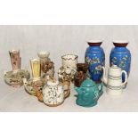 A collection of various vases, teapots including a Devonmoor Simple Simon tea pot, two Foresters