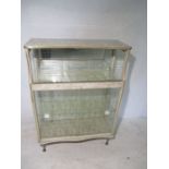 A retro glass and mirror display cabinet.