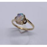 A 14ct gold ring set with an opal