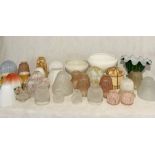 A large collection of vintage glass light shades, sconces etc