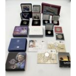 A collection of boxed silver proof and commemorative coins with certificates including The Queen
