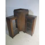 An Art Deco corner display unit with cupboard..