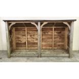 A wooden log store W240cm H135cm/110cm D74cm