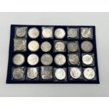 A tray of commemorative crowns, five shillings etc including some silver.