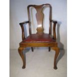 A Queen Anne style carver chair on cabriole legs.