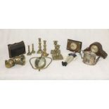 An assortment of items including brassware, mantle clocks, a vintage ladies handbag with
