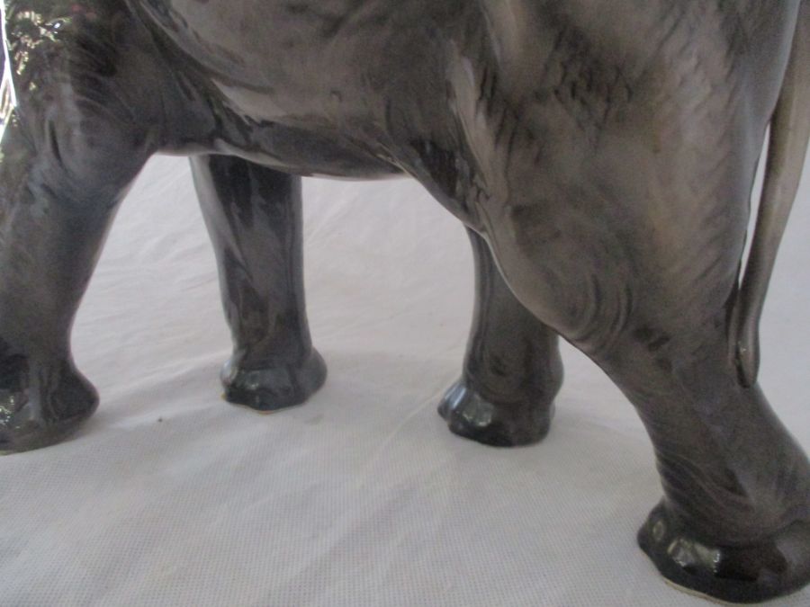 A ceramic elephant. Height 41cm. Has had a repair to one tusk. AF - Image 4 of 15