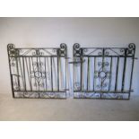 A pair of decorative wrought iron gates