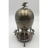 A silver plated egg coddler