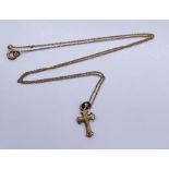 A 9ct gold cross on fine 9ct chain, total weight 1.2g