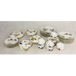 A Royal Worcester Evesham part dinner service including terrines, dinner plates, cups and saucers