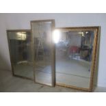 Three gilt framed mirrors. 126cm x 45cm, 112cm x 86cm and 110cm x 84cm.