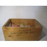 A collection of ordnance survey maps in a wooden crate. Areas covered include Norfolk, Ely, West
