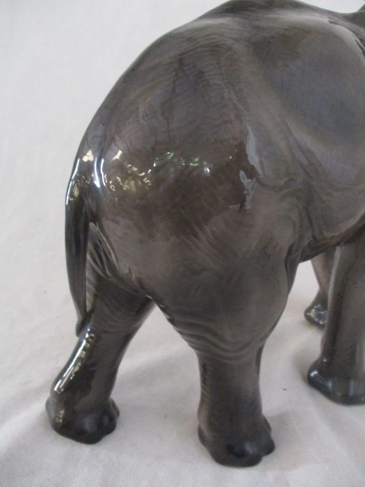A ceramic elephant. Height 41cm. Has had a repair to one tusk. AF - Image 7 of 15