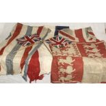 A collection of vintage flags including Union Jack etc.