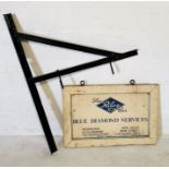 A vintage wooden painted hanging sign "Riley Car Blue Diamond Service" for a local garage in