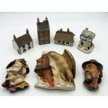A collection of Denby village houses, two Bosson wall plaques etc.