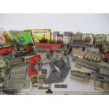 A collection of model railway buildings and accessories including platforms, stations, outbuildings,