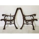 A pair of cast iron bench ends