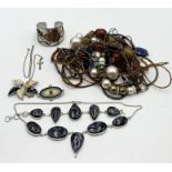 A collection of costume jewellery including silver necklace and matching bracelet
