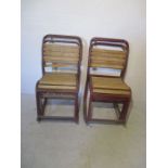 A set of eight tubular and slatted stacking chairs - few slats missing