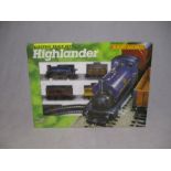 A boxed Hornby Railways OO gauge Highlander Electric Train Set - Contents included a locomotive, one