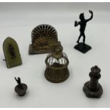 An assortment of items including small bronze statue, an onyx Napoleon plaque, silver plated