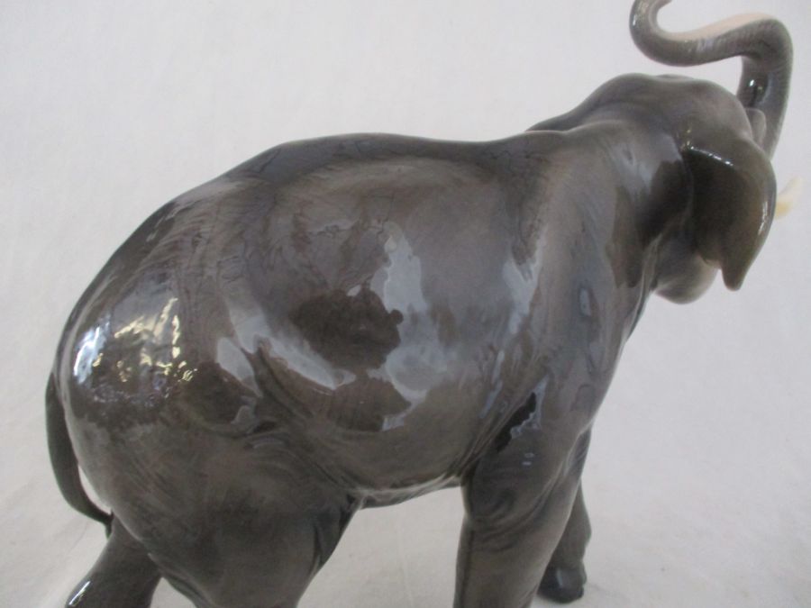 A ceramic elephant. Height 41cm. Has had a repair to one tusk. AF - Image 11 of 15