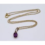 An amethyst pendant on fine 9ct gold chain