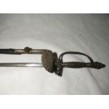 A late 19th or early 20th century dress rapier with trefoil blade, the cross guard and grip with cut