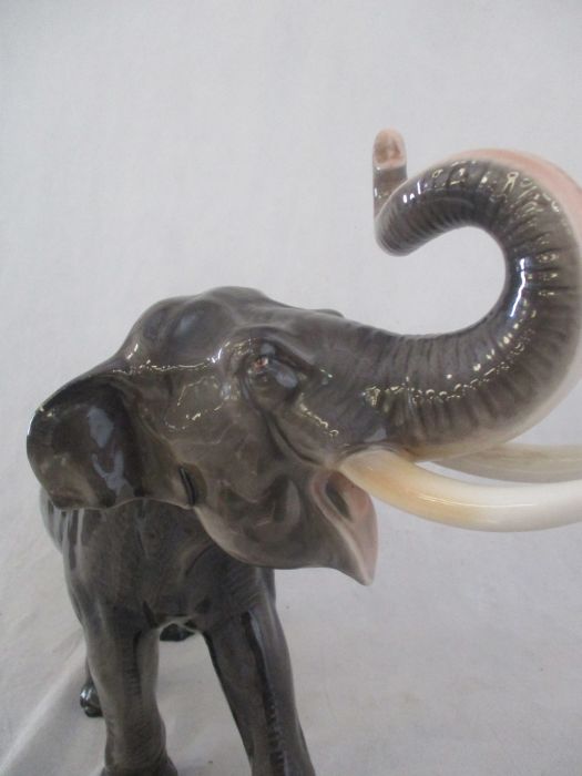 A ceramic elephant. Height 41cm. Has had a repair to one tusk. AF - Image 12 of 15