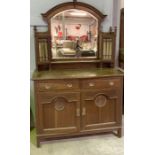 A Harris Lebus Arts and Crafts oak mirrored back sideboard with two drawers and cupboard under. Sold